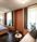Der Schlafbereich der Suite Garmisch 1936 mit Doppelbett und Couch